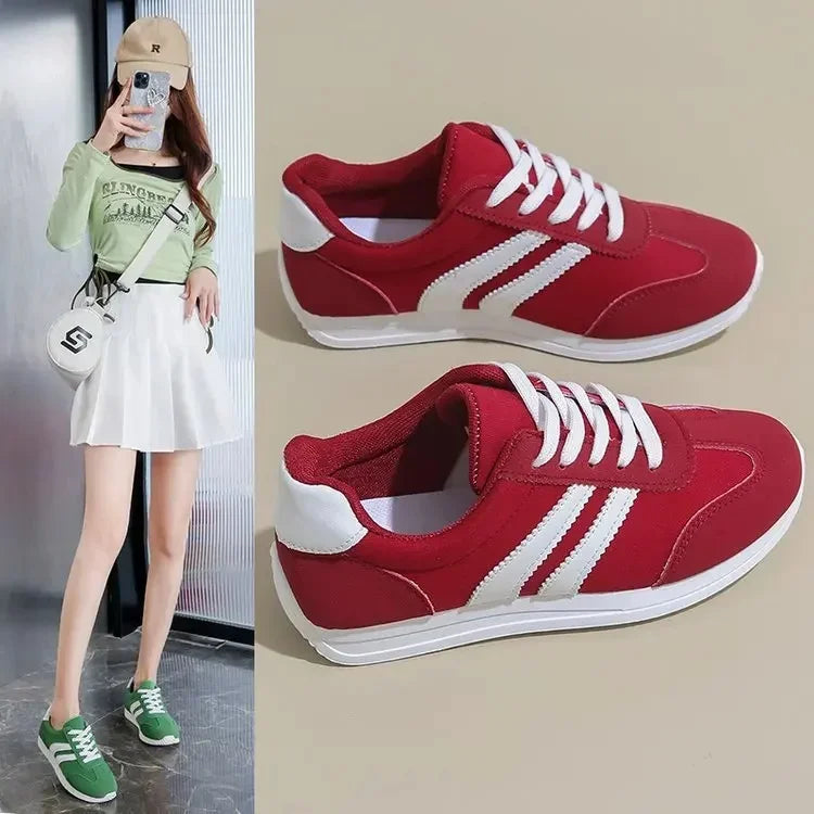 Red casual slip on sneakers with white stripes and laces displayed next to a model wearing green version