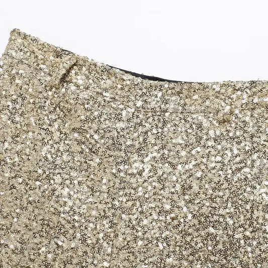 Close-up of elegant mid waist sequin shorts in gold from The Lady's Haven Boutique