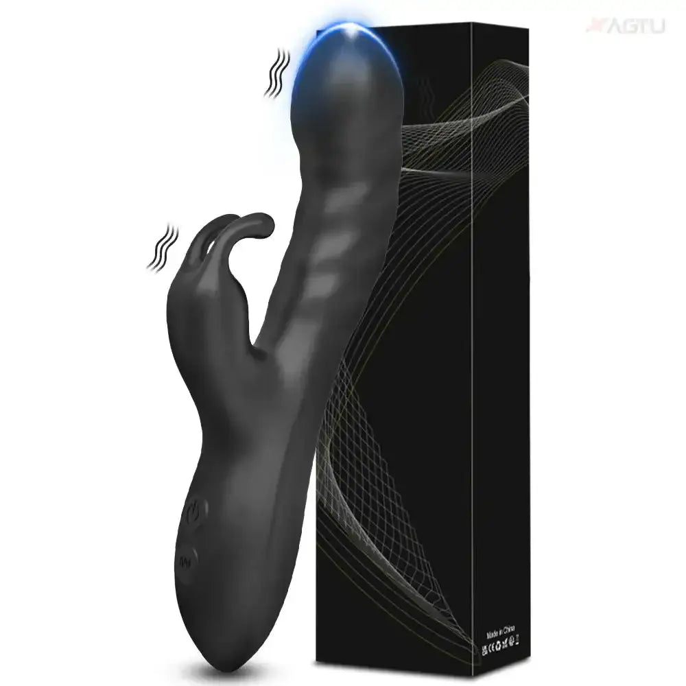 Black rabbit vibrator with clitoral stimulator, next to its packaging.