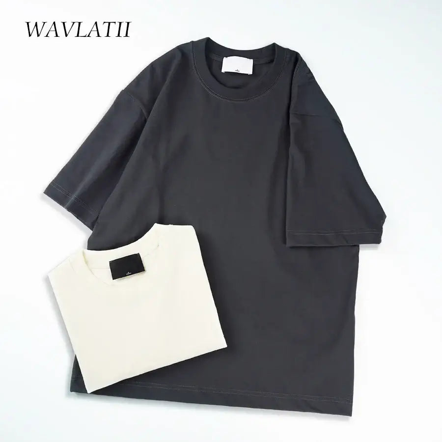WAVLATII Oversized Summer T Shirts for Women Streetwear Tees in black and white, perfect for casual summer style.