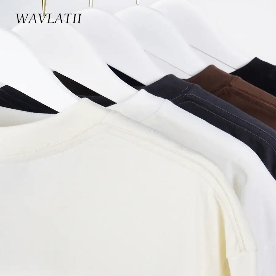 WAVLATII Oversized Summer T Shirts for Women Streetwear Tees displayed in various colors on hangers.