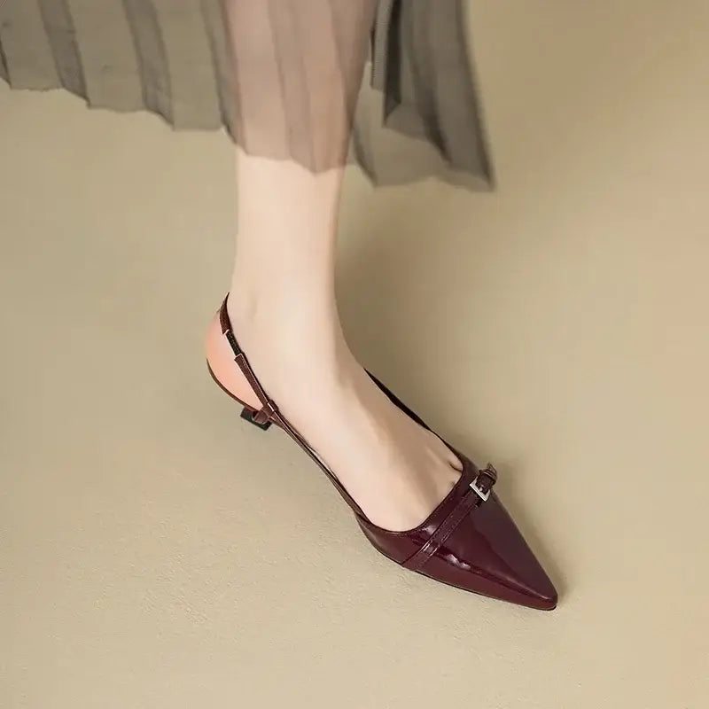 Burgundy pointed slingback heel with mini buckle, elegant women's dress shoe.