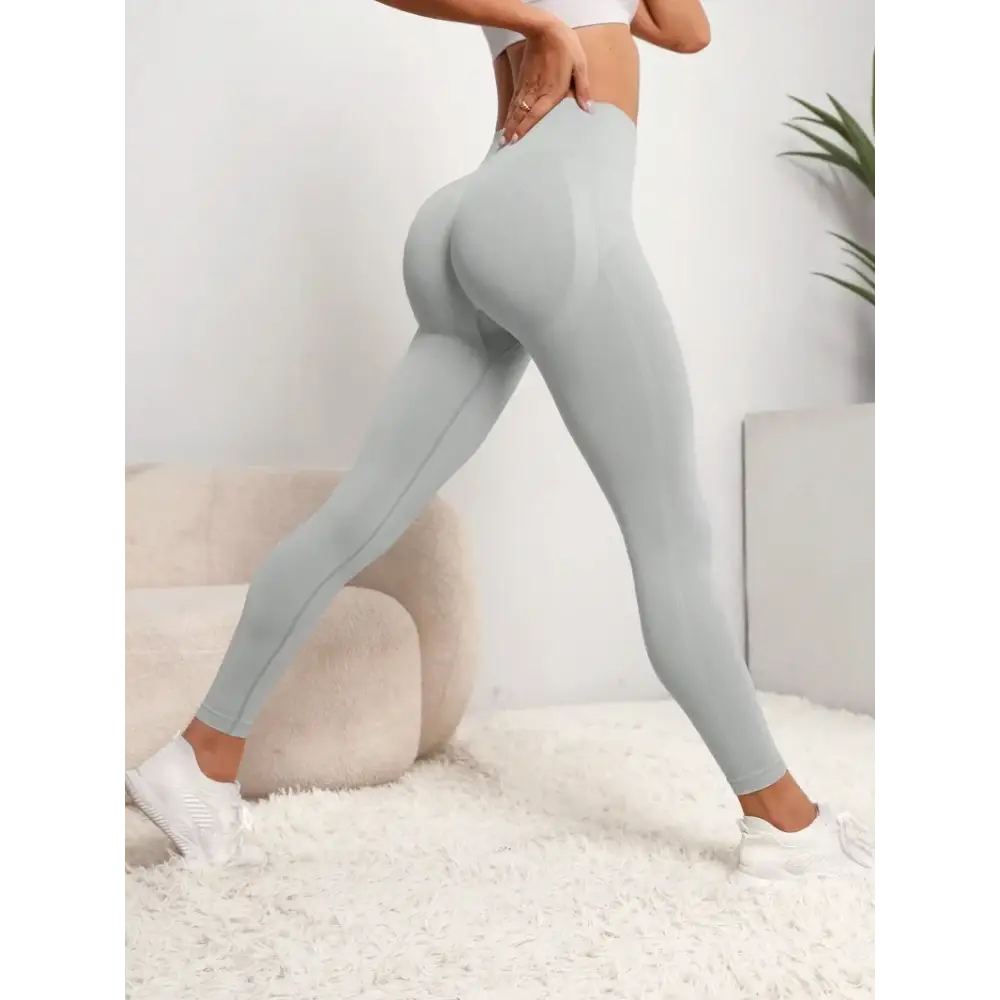 Stylish Women Seamless Hip Lifting Sports Leggings High Waist Fitness Leggings by OVESPORT for yoga and gym workouts.