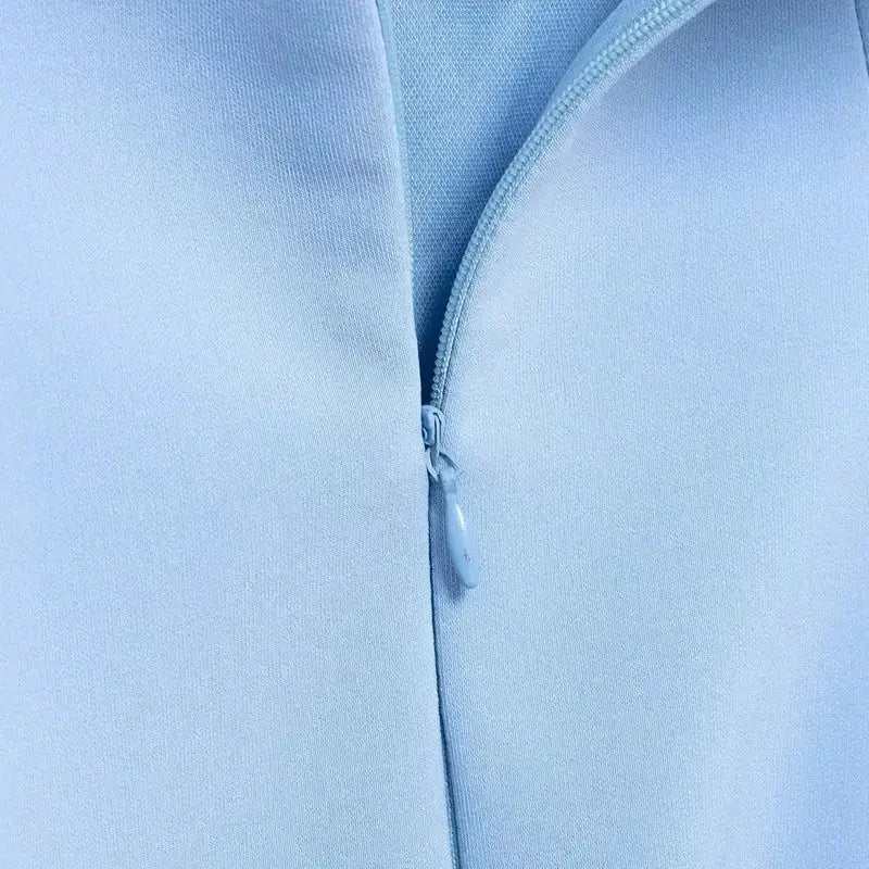 Close-up of zipper detail on blue mini party dress from The Lady's Haven Boutique