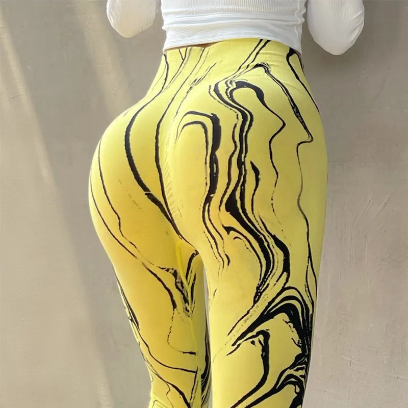 Ladies yoga clothing boutique featuring vibrant yellow leggings with unique marble patterns for stylish movement