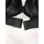 Black adjustable shoulder strap lingerie with hook and eye closure shown from the back