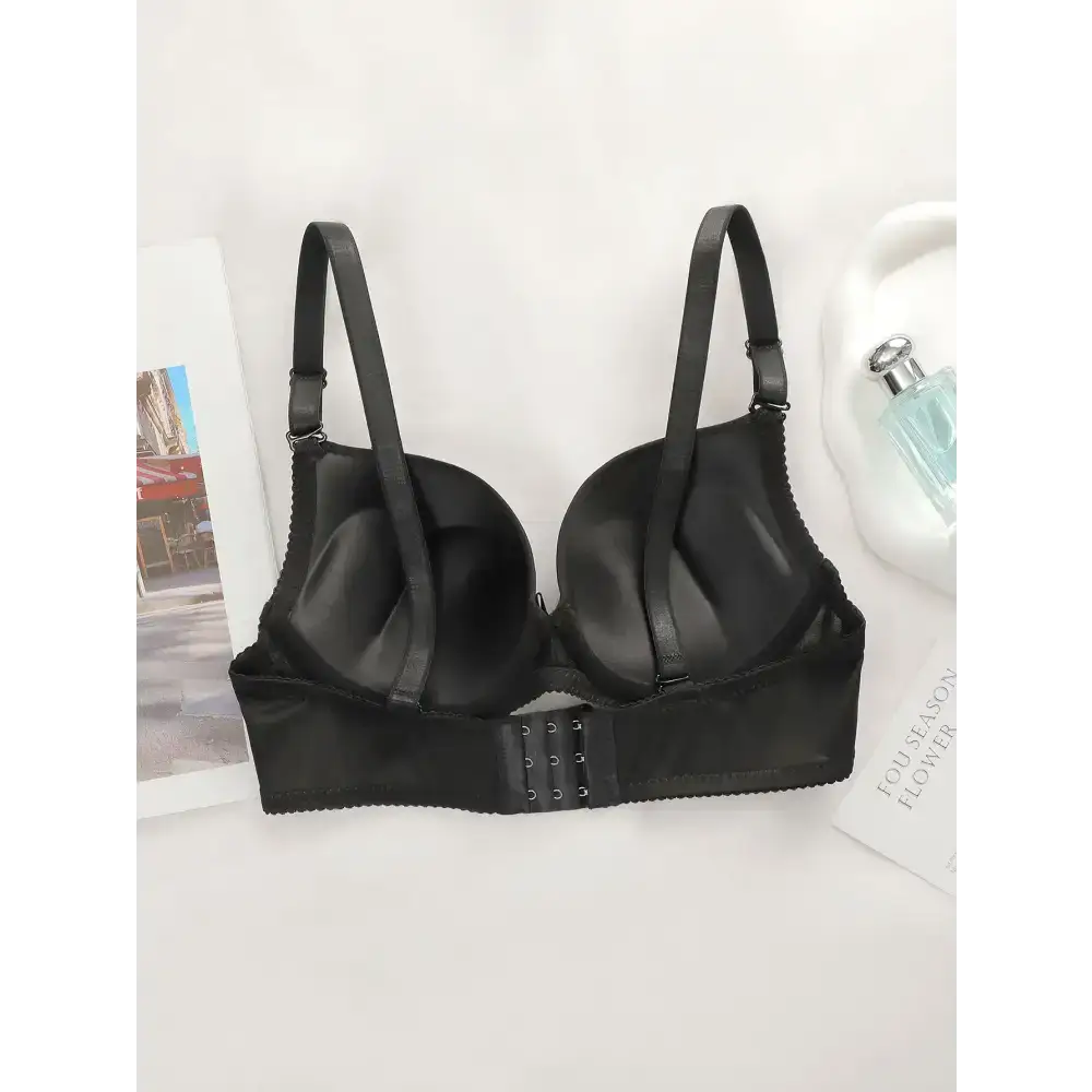 Black bra with adjustable shoulder strap lingerie and hooked back closure from The Lady's Haven Boutique