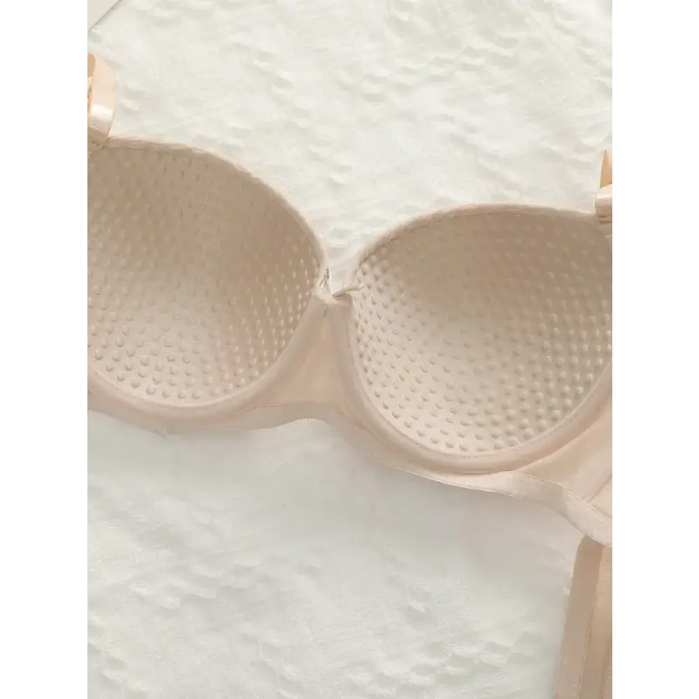 Beige adjustable shoulder strap lingerie bra with textured cups from The Lady's Haven Boutique