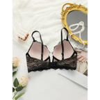 Black adjustable strap lace bra for women with floral lace design laid on white fabric background