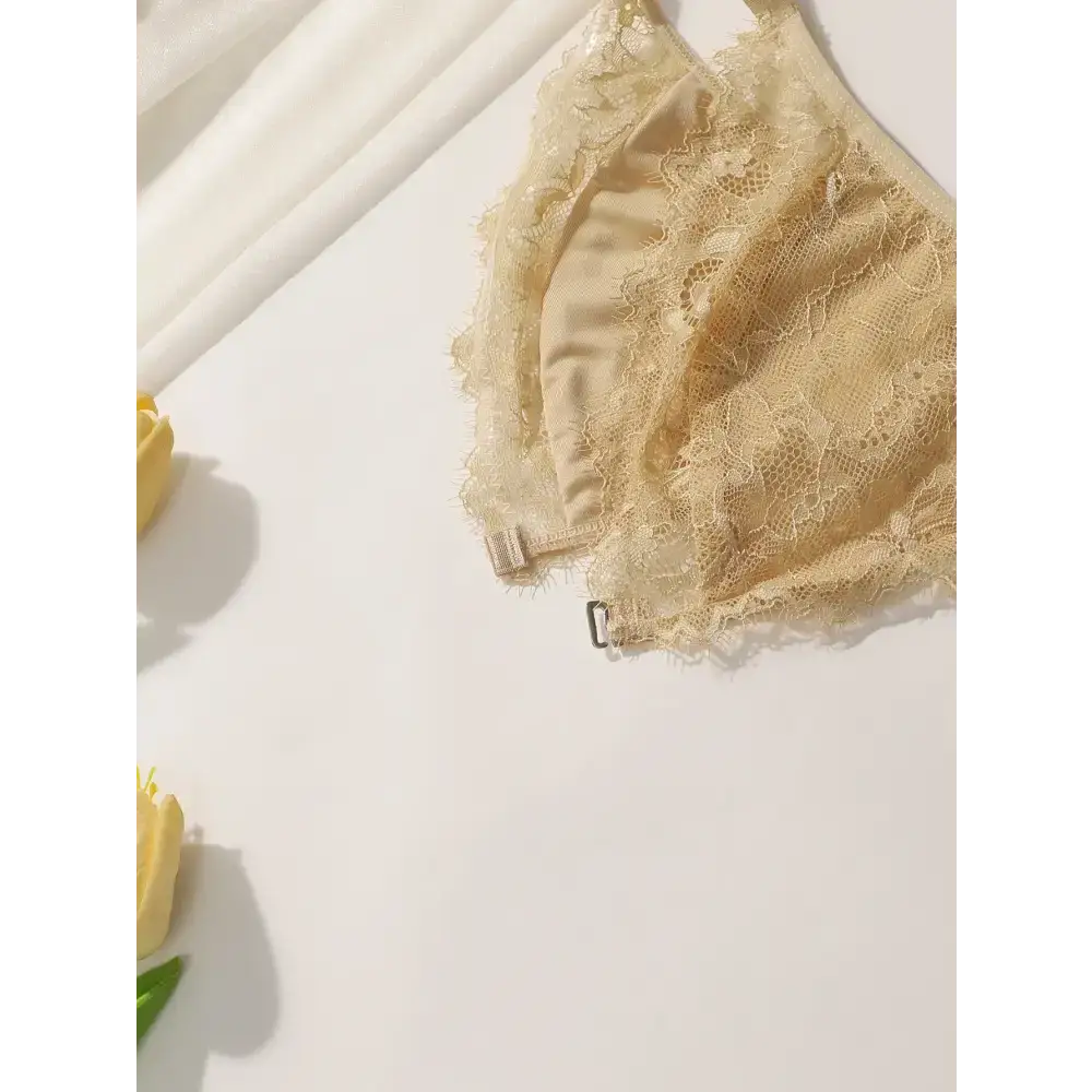 Beige lace wireless bra with adjustable strap wireless bra design displayed on white background