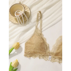 Beige lace adjustable strap wireless bra laid flat with pearl necklace and yellow tulips