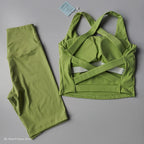 Stylish 2 piece workout outfit in vibrant green featuring a crisscross crop top and matching leggings