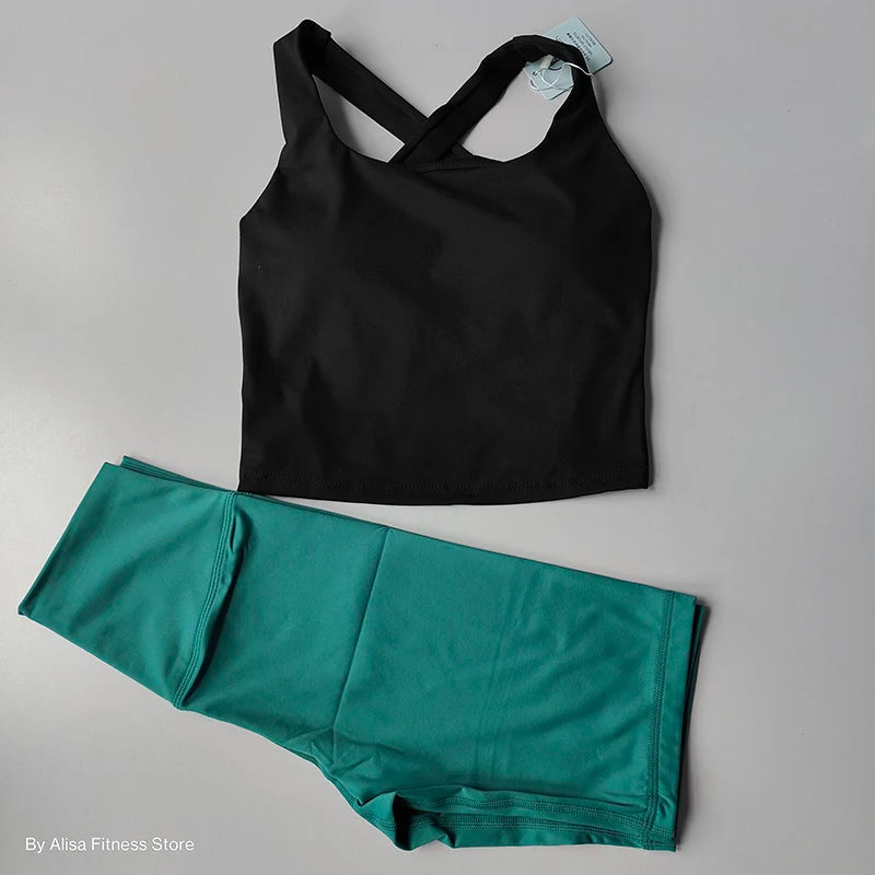 Ladies sports bra and shorts set in black and teal for comfortable workout sessions