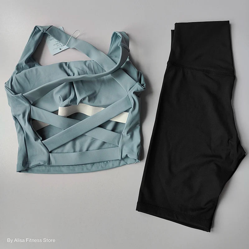 Ladies sports bra and shorts set in teal and black for comfortable workouts and active lifestyles
