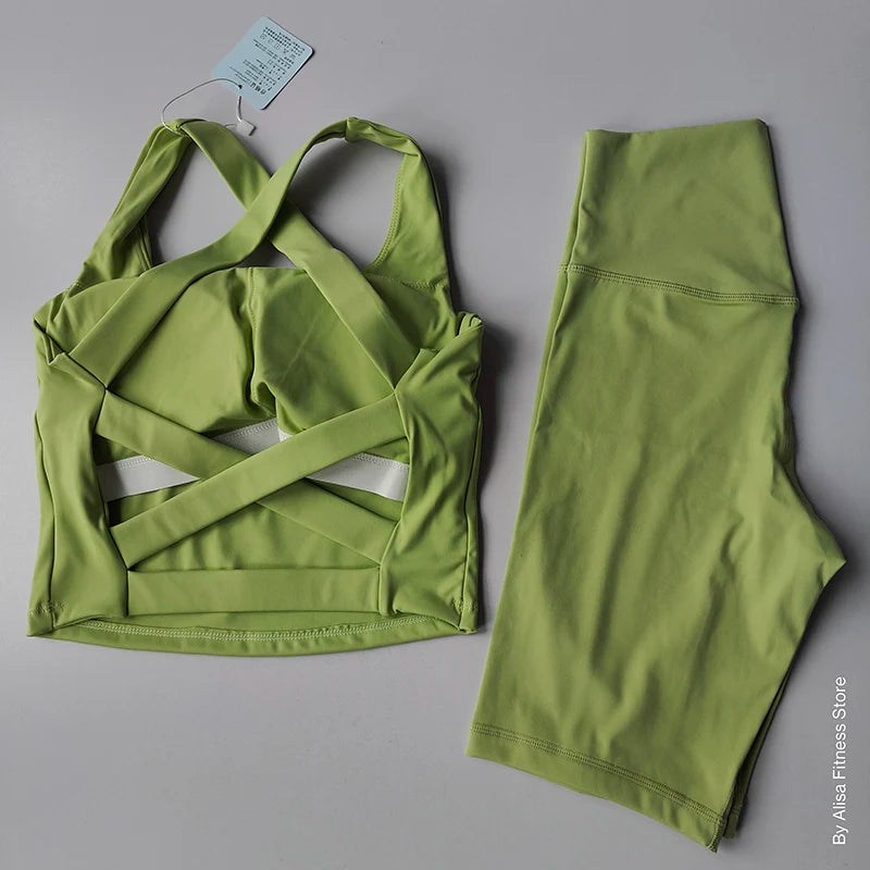 Ladies sports bra and shorts set in vibrant lime green with stylish cross-back design