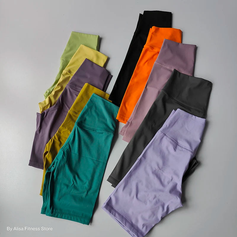 Variety of colorful ladies sports bra and shorts set displayed for activewear fashion