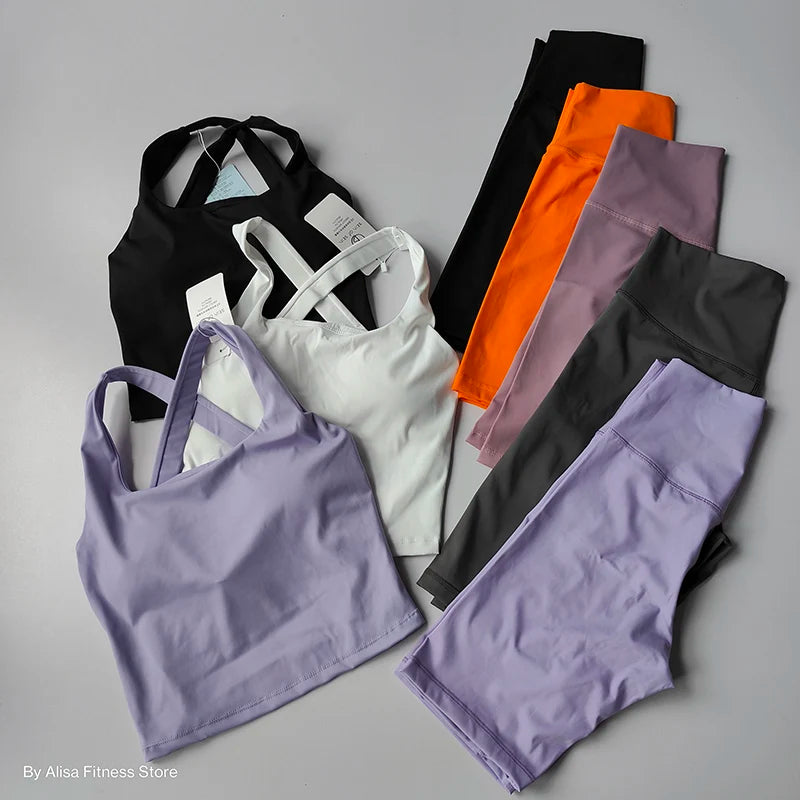 Ladies sports bra and shorts set in various colors including black, white, purple, and orange for stylish workouts