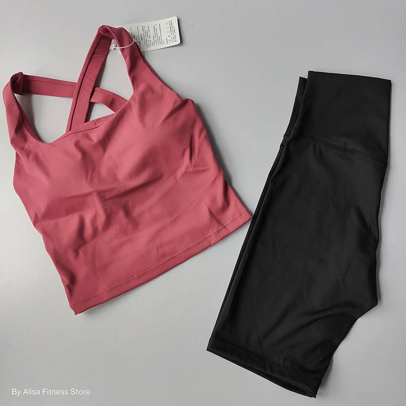 Ladies sports bra and shorts set in pink and black for comfortable workouts and activewear