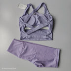 Ladies sports bra and shorts set in lavender with stylish criss-cross design for active wear