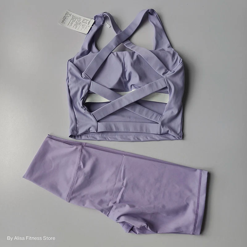 Ladies sports bra and shorts set in lavender with stylish criss-cross design for active wear