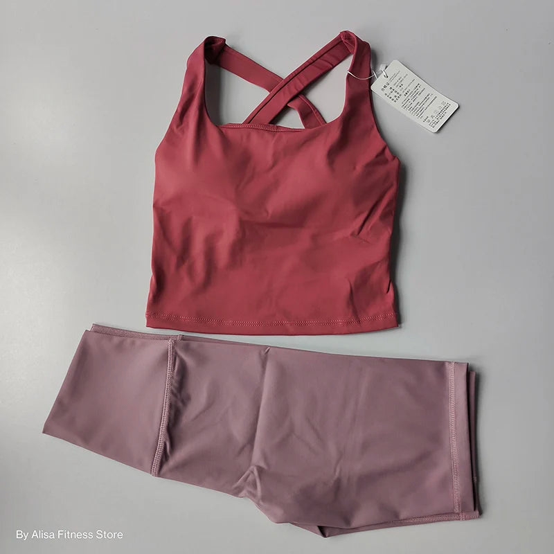 Ladies sports bra and shorts set in peach and mauve for comfortable workout sessions