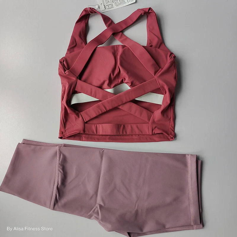 Ladies sports bra and shorts set in maroon and mauve with stylish cross-back design