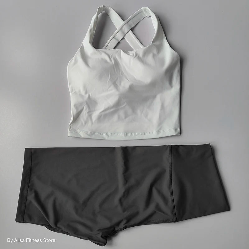 Ladies sports bra and shorts set in white and gray for workout and fitness activities