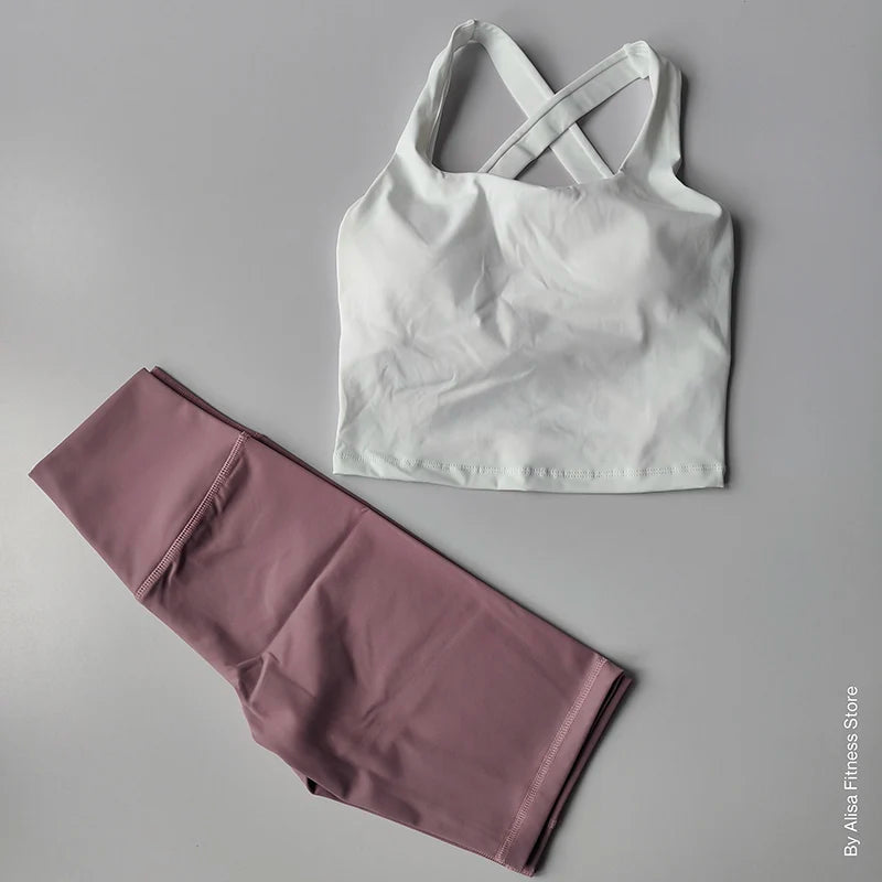 Ladies sports bra and shorts set in white and mauve, perfect for active wear and workouts