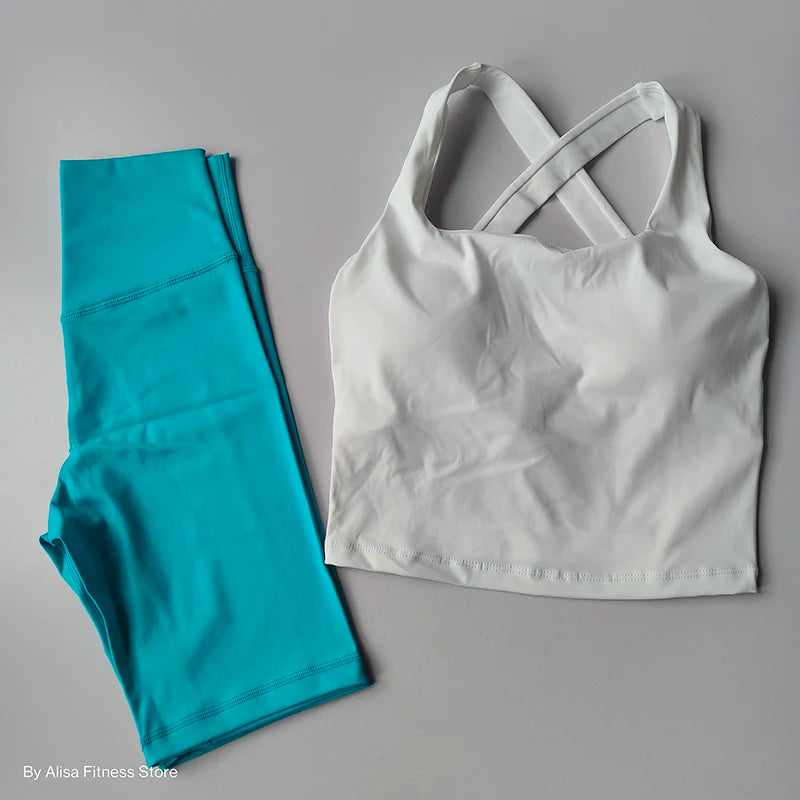 Ladies sports bra and shorts set in white and teal, perfect for workout sessions and leisure wear