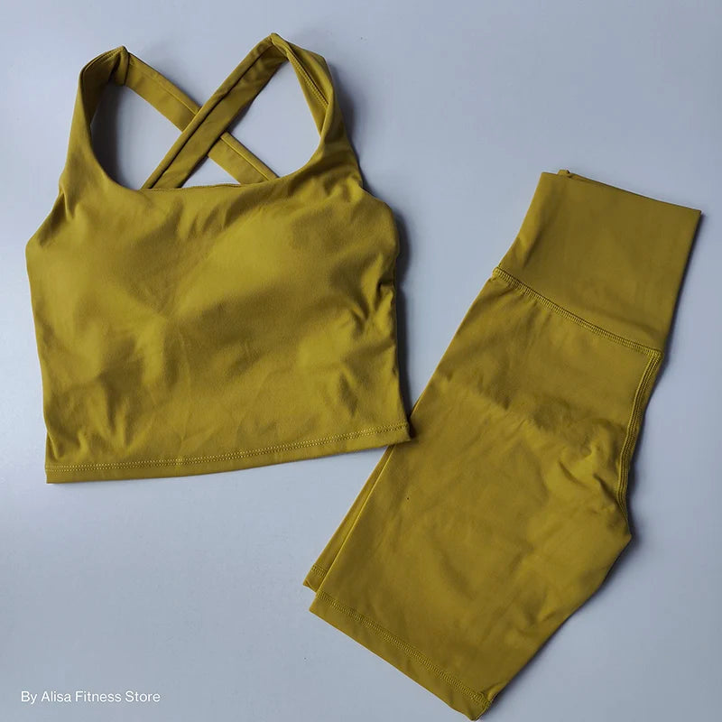 Ladies sports bra and shorts set in olive green with cross-back design for activewear enthusiasts