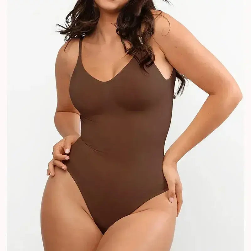 Brown backless bodysuit shapewear with thin straps worn by woman for smooth silhouette