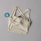 Cream beauty back yoga bra with crisscross straps for comfort and support during workouts