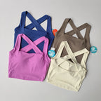 Variety of beauty back yoga bras in blue, pink, brown, and cream for stylish workouts