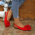 Red flat heel big flower embellished sandals from The Lady's Haven Boutique worn with jeans