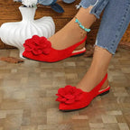 The Lady's Haven Boutique red flat heel big flower embellished sandals worn with blue jeans