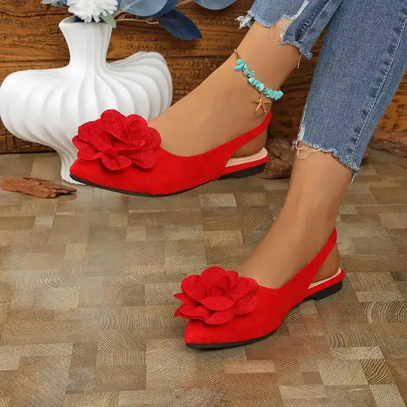The Lady's Haven Boutique red flat heel big flower embellished sandals worn with blue jeans