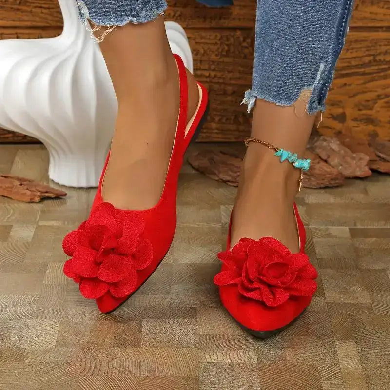 Red flat heel big flower embellished sandals from The Lady's Haven Boutique worn with blue jeans