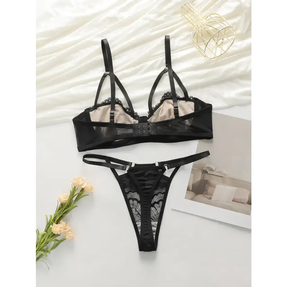 Black low waisted thong bra set with lace detailing and adjustable straps from The Lady's Haven Boutique