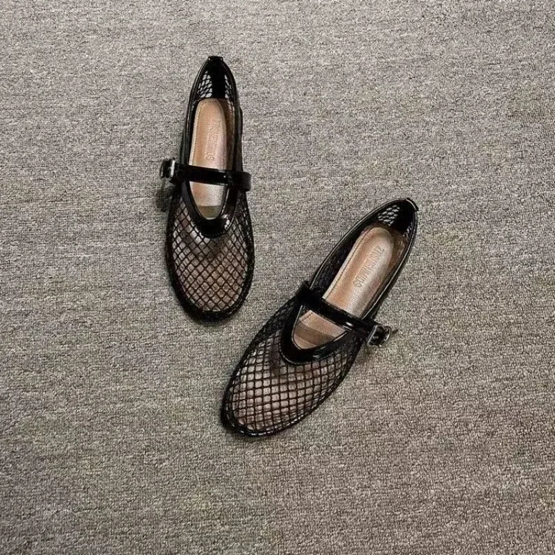 Black mesh fashion sandals with buckle strap from The Lady's Haven Boutique on gray carpet