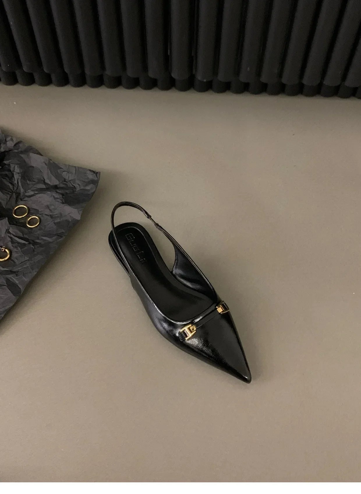 The Lady's Haven Boutique black pointed toe mid heel sandals with slingback strap and gold buckle detail