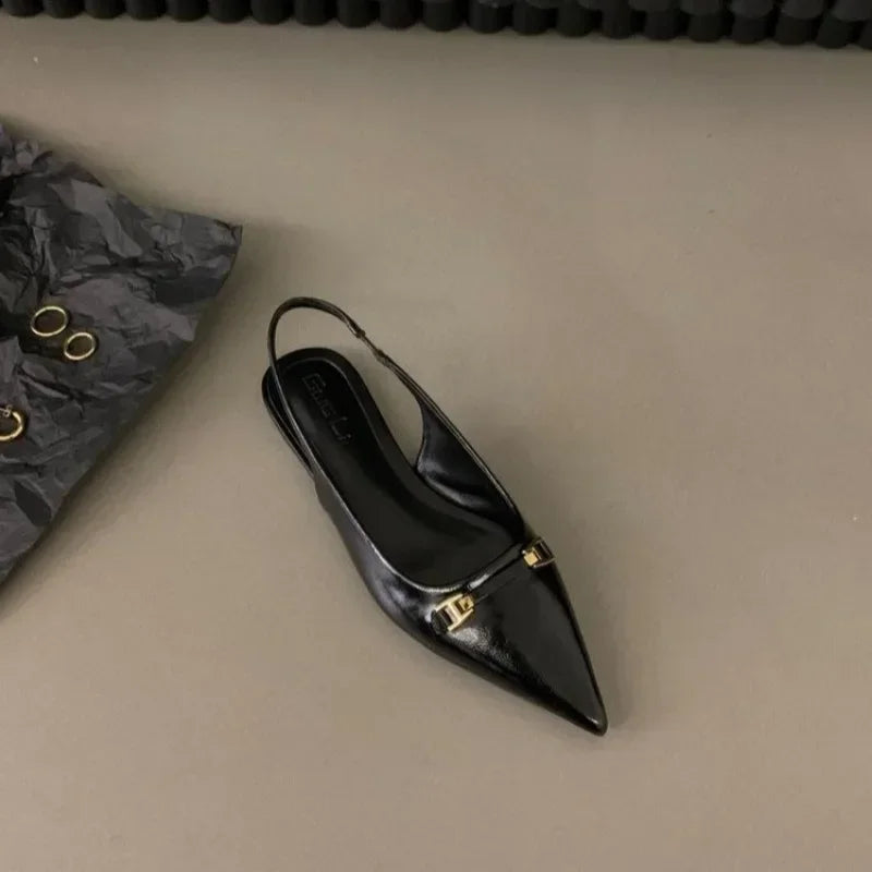 Black pointed toe mid heel sandals with gold buckle detail from The Lady's Haven Boutique