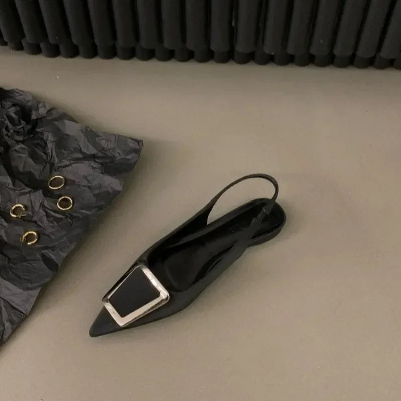 Black pointed toe mid heel sandals with silver buckle detail from The Lady's Haven Boutique
