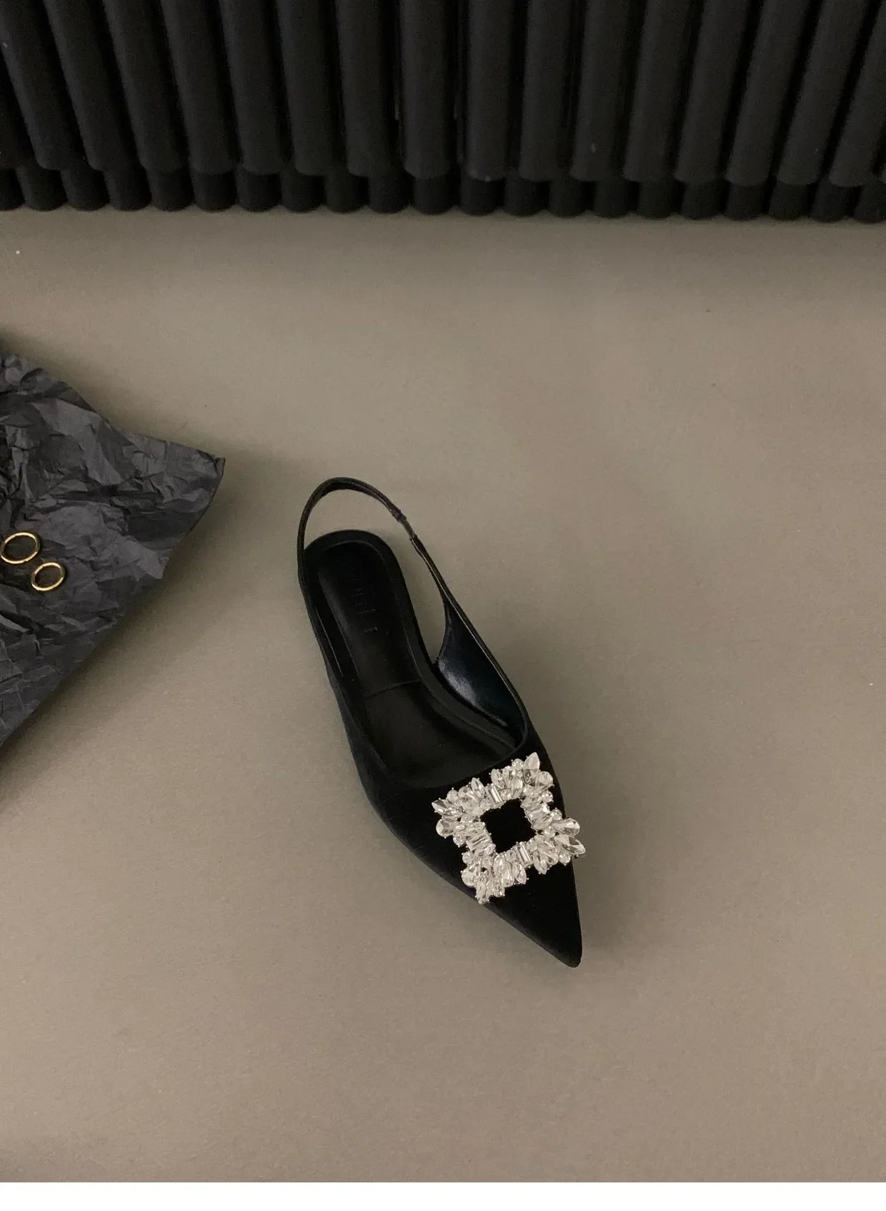 Black pointed toe mid heel sandals with jeweled buckle detail from The Lady's Haven Boutique