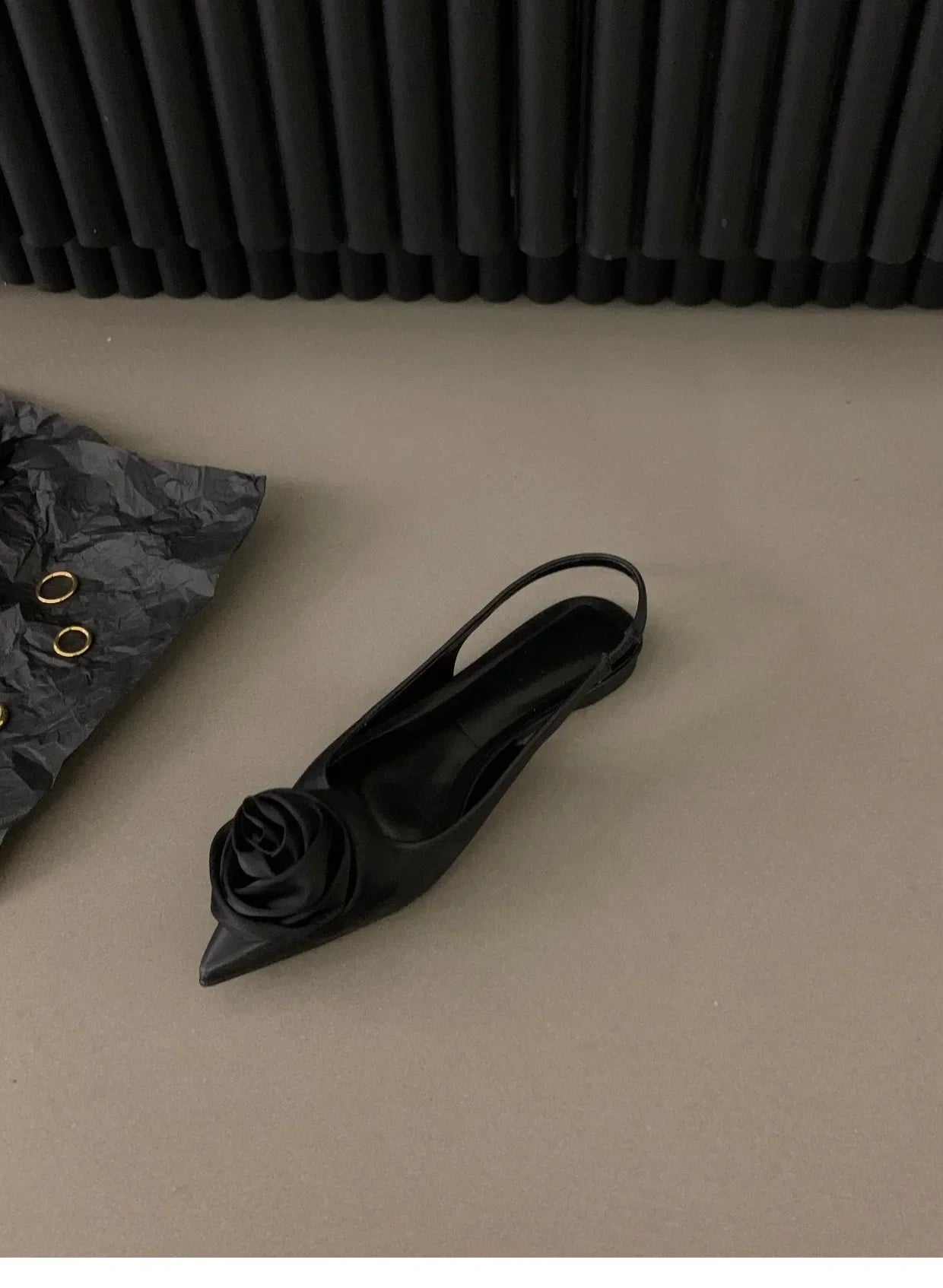 Black pointed toe mid heel sandals with floral embellishment from The Lady's Haven Boutique