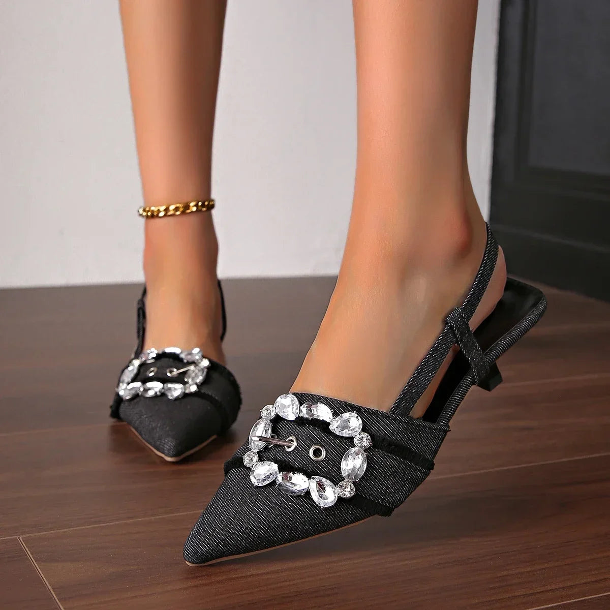 Black pointed toe stiletto sandals with jeweled buckle and slingback strap by The Lady's Haven Boutique