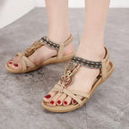 Beige flat heel bohemian beaded summer sandals with decorative straps from The Lady's Haven Boutique