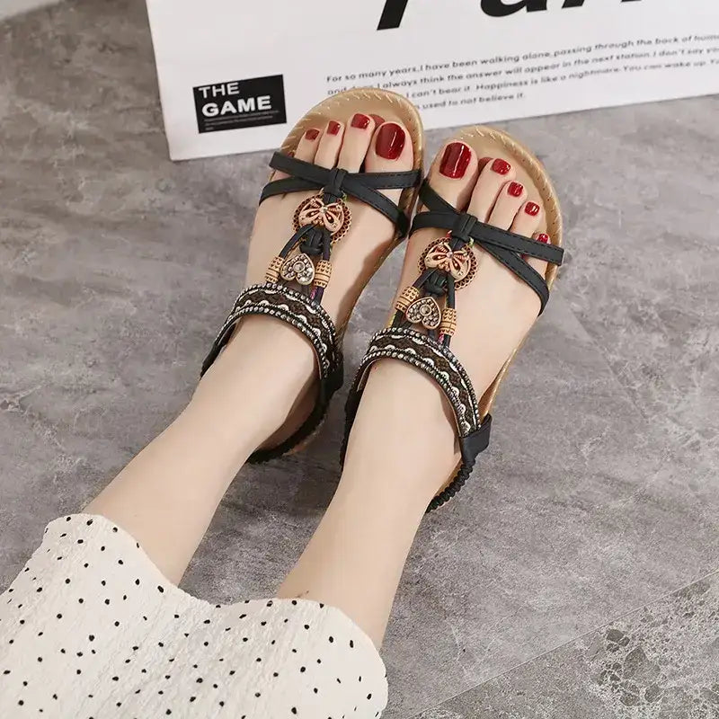 Bohemian beaded summer sandals flat heel sandals from The Lady's Haven Boutique on feet with red nail polish