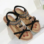 Bohemian beaded summer sandals flat heel with black straps and decorative charms from The Lady's Haven Boutique