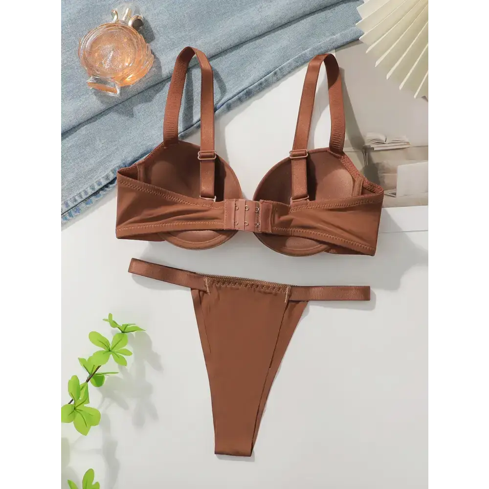 Brown thick padded bra for small breasts with matching thong lingerie set laid flat
