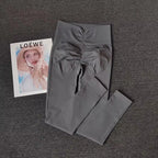 Gray breathable gym leggings with a stylish ruched design for comfort and performance
